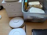 a box of electronics on a desk next to a window