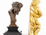 pair of bronze sculptures of a man and a woman on a marble base