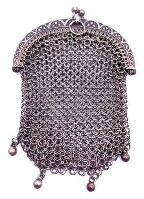 a close up of a chainmail purse on a white background