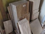 a pile of cardboard sitting on the floor next to a door