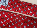 a red neck tie with a picture of a dog on it