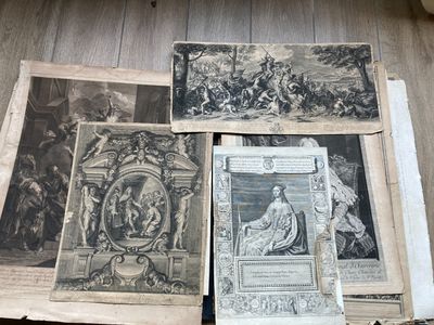 many old books on the floor with pictures on them