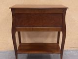 a small wooden table with a shelf on top of it