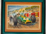 tableau représentant une voiture de course, encadré de vert, accroché au mur