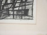 a black and white drawing on a wall next to a vase