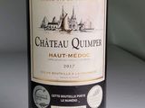 a bottle of wine that is sitting on a table
