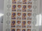 the stamps are on a sheet of paper with a picture of a woman