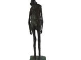 statue of a man holding a tennis racquet on a marble base