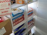 a refrigerator that has a lot of boxes on it