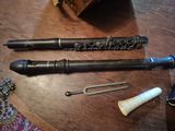 two flutes on a table with a pair of scissors on it