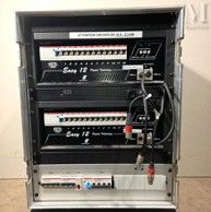 an image of a rack with a bunch of electronic equipment on top of it