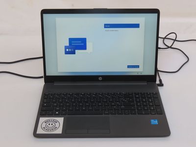 a laptop that is sitting on a table with a mouse