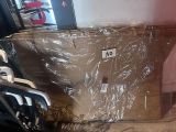 a large box sitting on top of a chair in a room