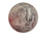 an image of a coin with a picture of a man smoking a pipe