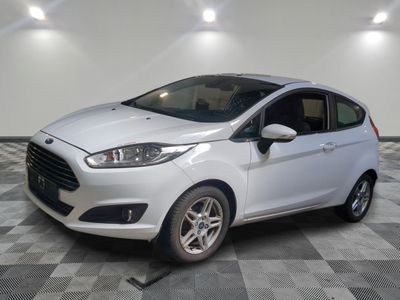 the white car is parked on a checkered floor in the garage