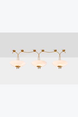 a set of three brass and glass wall lights