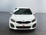 the front view of a white car in a showroom