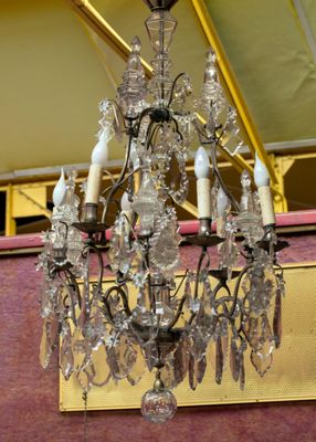 a chandelier hanging from the ceiling in a room