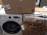 a stack of boxes and a washing machine on a pallet