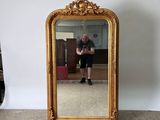 a man taking a picture of himself in a mirror