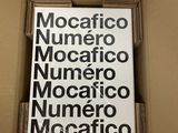 a cardboard box with a sign in it that says mocafico