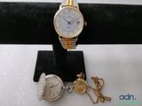 an image of a couple of watches sitting on top of a black stand