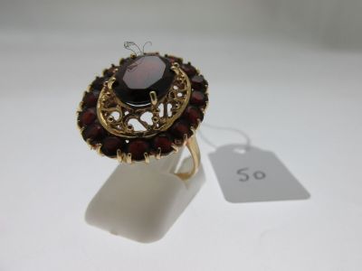 an image of a ring with a garnetite stone