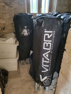a toilet and a trash can in a small room