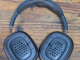 an image of a pair of headphones sitting on top of a wooden table