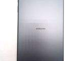 a close up of the back of a tablet computer on a white surface