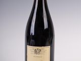 a bottle of wine that is sitting on a table
