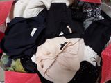 a suitcase full of clothes sitting on the floor