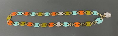 a close up of a colorful bracelet with a metal clasp