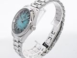an image of a close up of a wrist watch with a blue dial