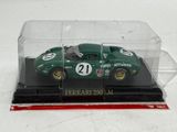 a model of a green race car in a clear case