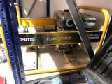 a man working on a machine in a garage