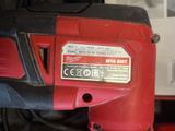 an image of a corded drill with a red and black handle