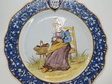 an image of a plate with a woman sitting on a chair