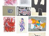 many pieces of art hanging on the wall together