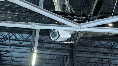 a camera that is hanging from the ceiling of a building