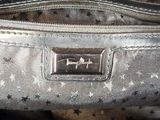 a close up of a handbag with stars on it