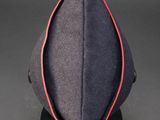 a close up of a hat on a stand with a black background