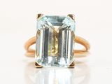 an image of a ring with an aquamarine stone in it