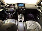 the interior of a car with a steering wheel, dashboard, and dashboard controls