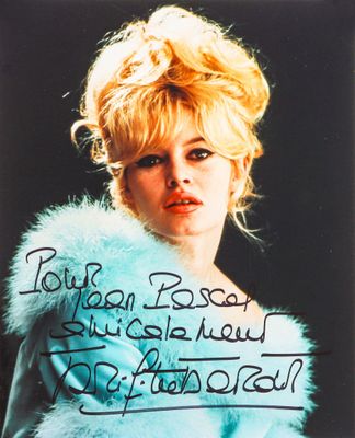 an old photo of a woman in a fur coat with writing on it