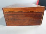 an old wooden box sitting on top of a white table
