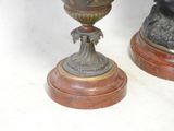 two vases sitting on top of each other on a table