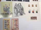 a lot of stamps and stamps on the table