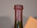 a bottle of wine that is sitting on a table