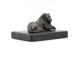 bronze statue of a lion on a marble base on a white background